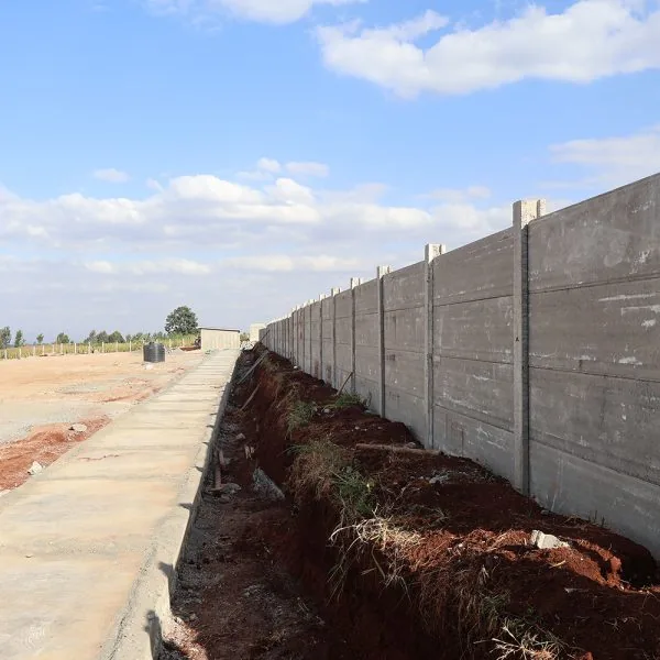 Precast concrete perimeter wall along a boundary